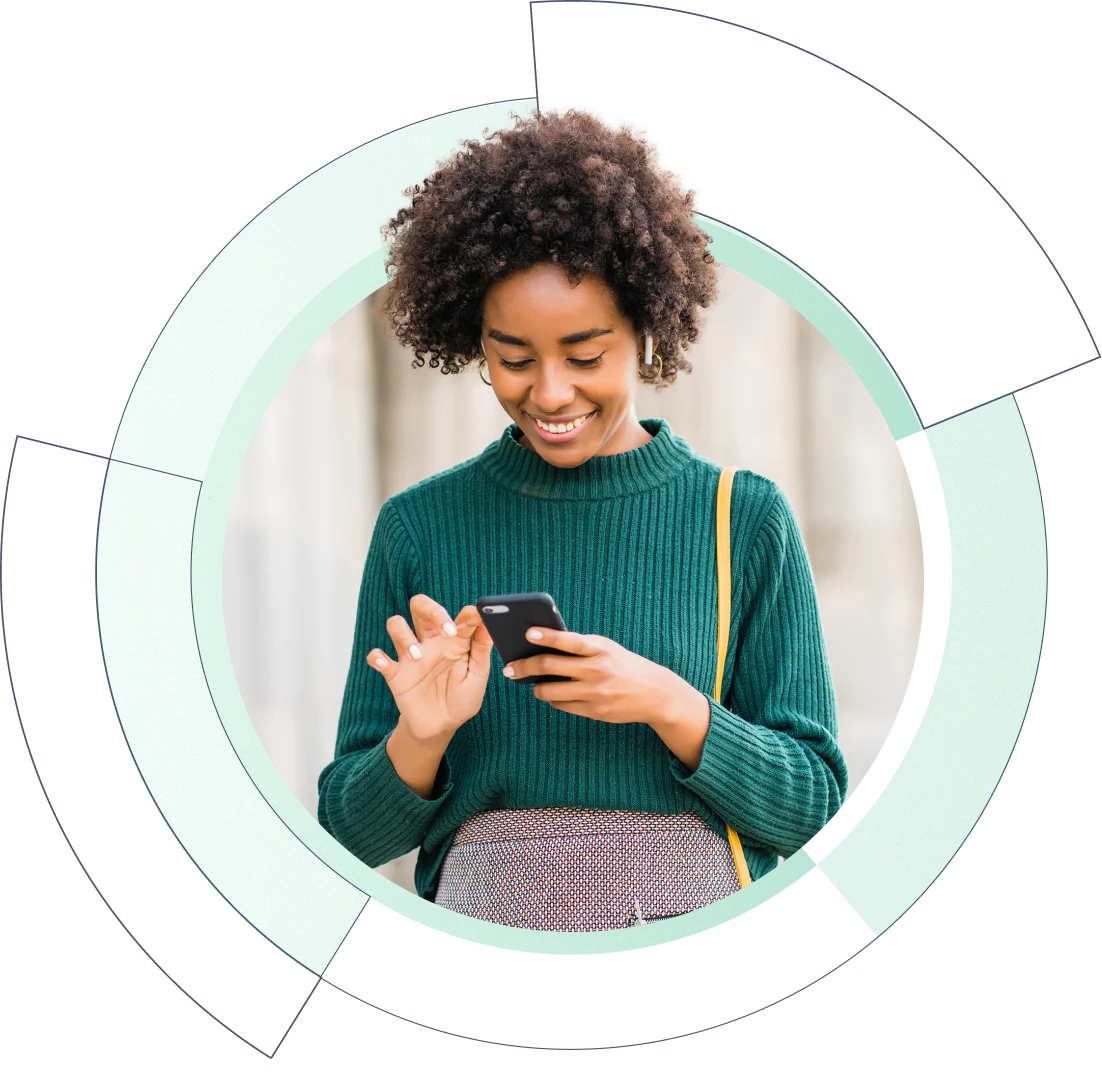 A woman gazes at her phone while standing in a tech circle , highlighting her focus on the device.